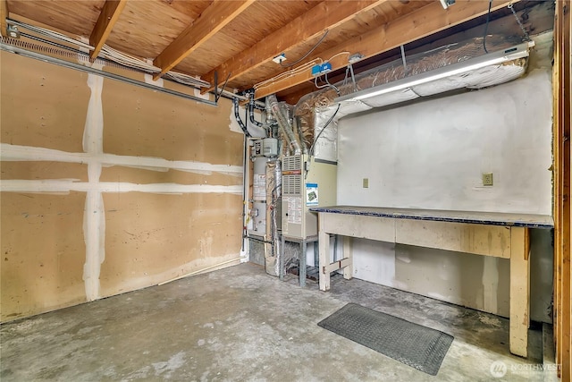 1002 30th St NE, Auburn, WA 98002 - unfinished basement with a workshop area and water heater