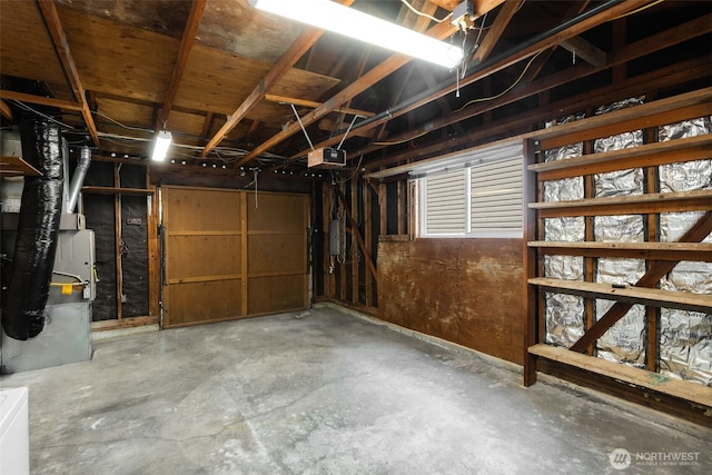 garage with a garage door opener and heating unit