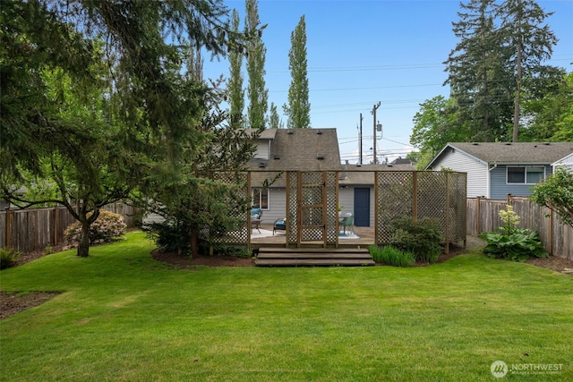 rear view of house with a wooden deck and a shingled roof