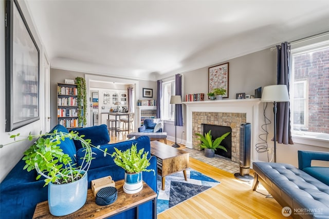 746 10th Ave E, Seattle, WA 98102 - living area featuring a tile fireplace and wood finished floors