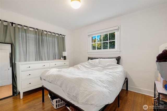 746 10th Ave E, Seattle, WA 98102 - bedroom featuring crown molding, baseboards, and wood finished floors