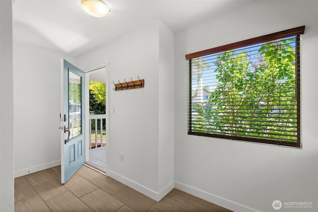 4822 S M St, Tacoma, WA 98408 - doorway to outside featuring baseboards