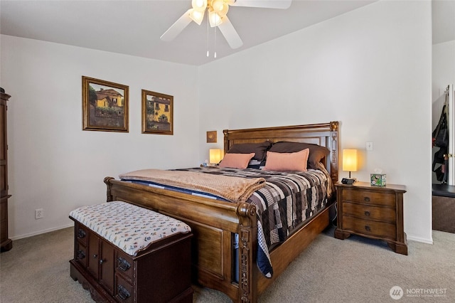 carpeted bedroom featuring ceiling fan and baseboards