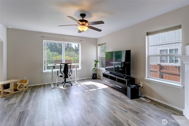 2824 187th St E, Tacoma, WA 98445 - office space featuring wood finished floors, a ceiling fan, and baseboards