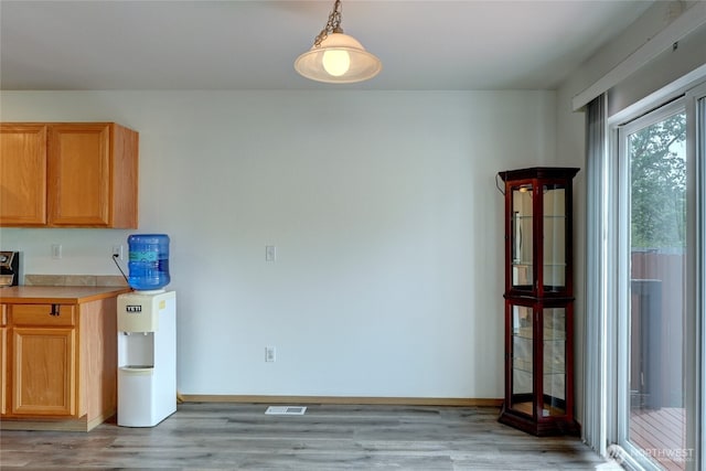 2824 187th St E, Tacoma, WA 98445 - kitchen with light wood-style flooring, baseboards, and light countertops