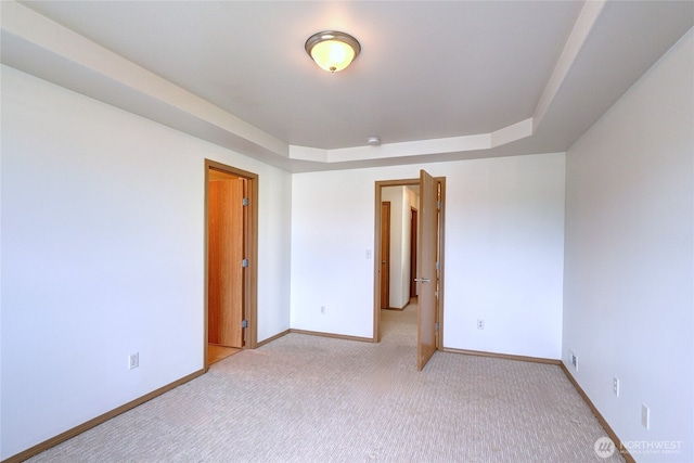 2824 187th St E, Tacoma, WA 98445 - unfurnished room with light carpet, baseboards, and a tray ceiling