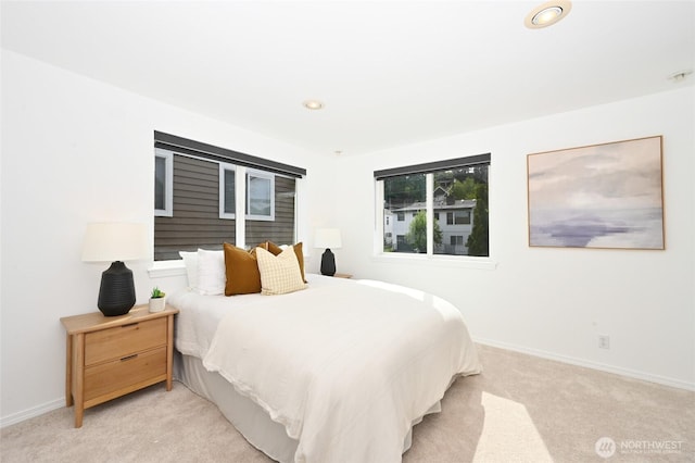 bedroom with light carpet, baseboards, and recessed lighting