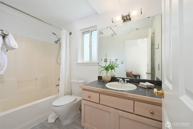 bathroom with toilet, vanity, and shower / tub combo with curtain