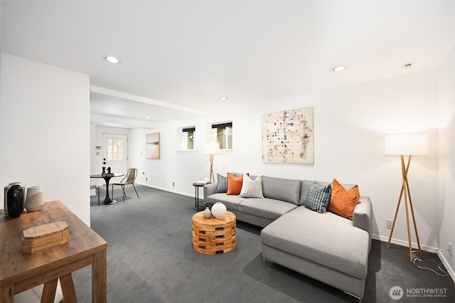 living room with dark colored carpet, baseboards, and recessed lighting