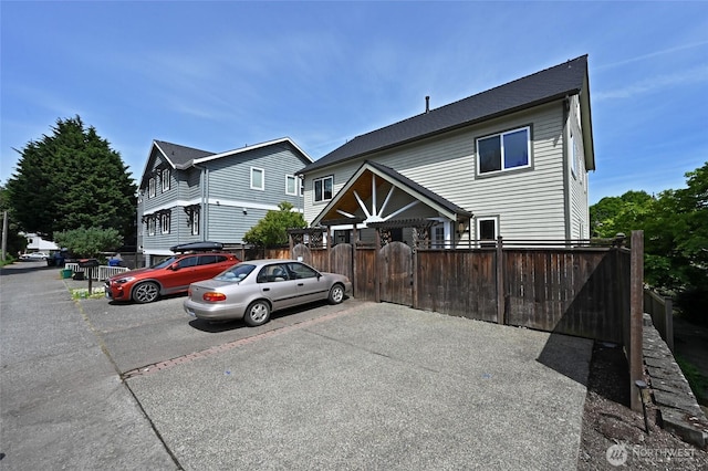 view of front of property featuring fence