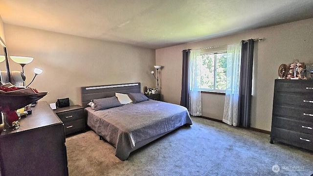 bedroom featuring light carpet
