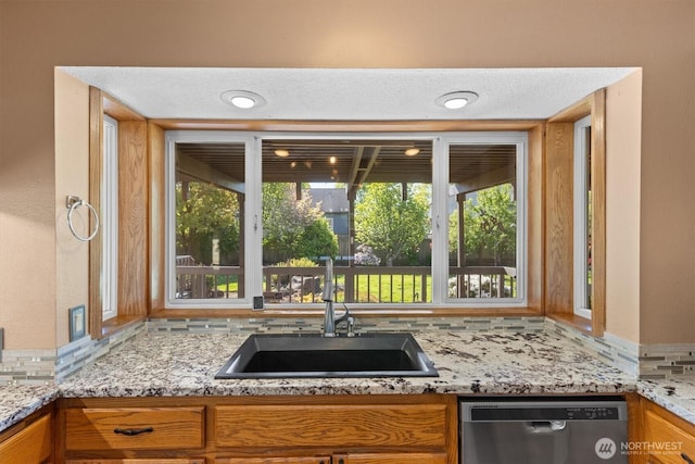 2350 38th Ave, Longview, WA 98632 - kitchen featuring dishwasher, a sink, tasteful backsplash, and healthy amount of natural light