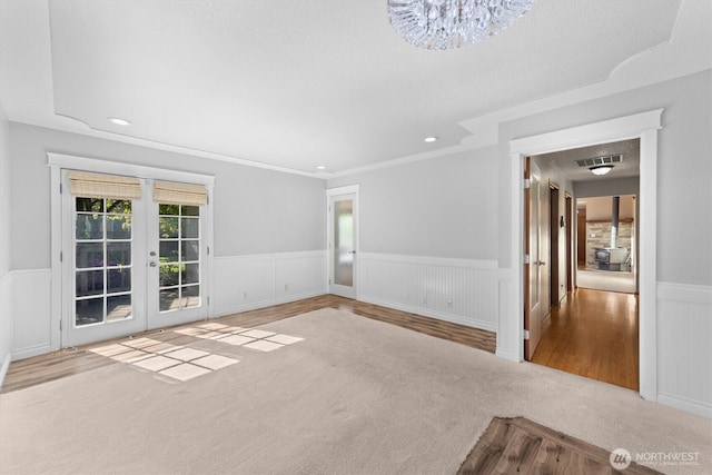2350 38th Ave, Longview, WA 98632 - unfurnished room with wainscoting, french doors, carpet flooring, a chandelier, and recessed lighting