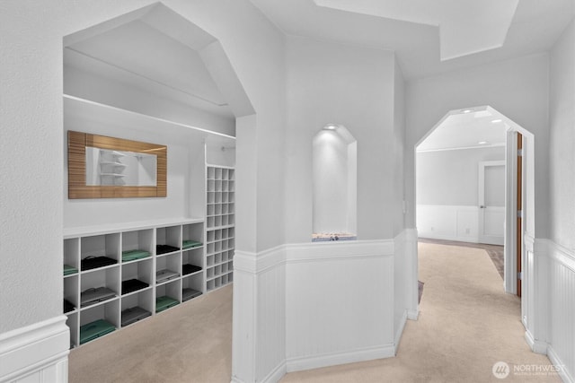 2350 38th Ave, Longview, WA 98632 - hall with wainscoting, carpet floors, arched walkways, and a decorative wall
