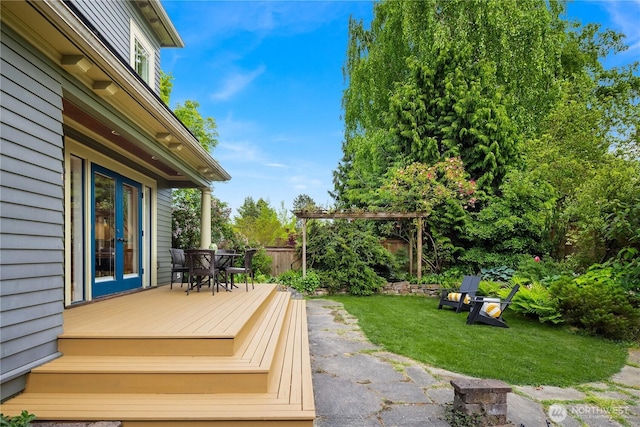 wooden terrace with outdoor dining area