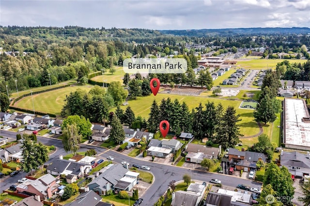 1004 30th St NE, Auburn, WA 98002 - aerial overview of property's location with nearby suburban area, a heavily wooded area, and a golf course