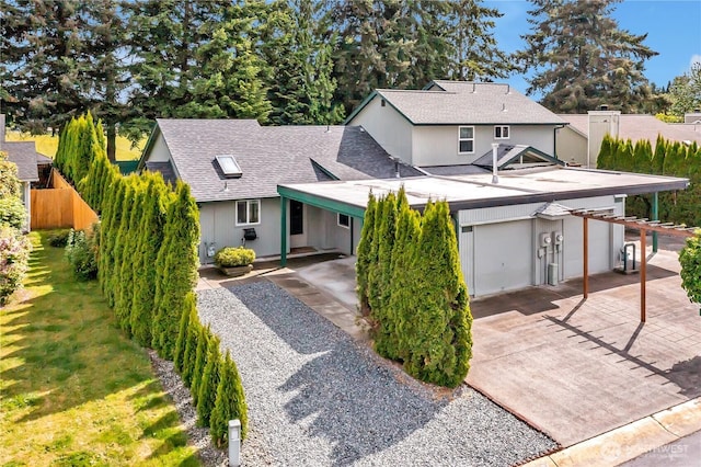 1004 30th St NE, Auburn, WA 98002 - view of front of home featuring a shingled roof, driveway, and a garage