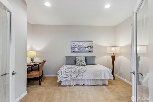 bedroom featuring light carpet, baseboards, and recessed lighting