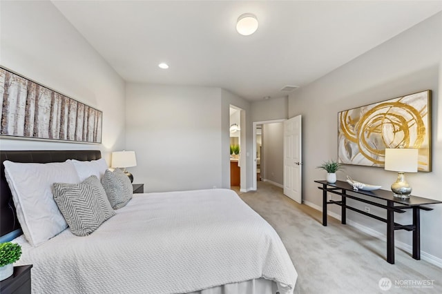 carpeted bedroom featuring baseboards and recessed lighting