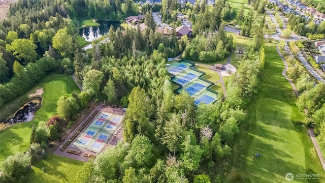 aerial view of residential area with a large body of water and a local golf course