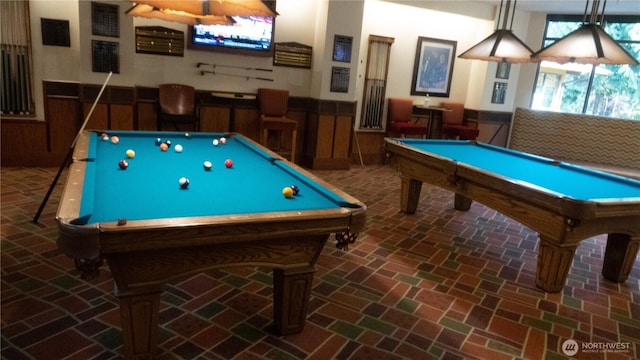 playroom featuring pool table, wainscoting, and brick flooring