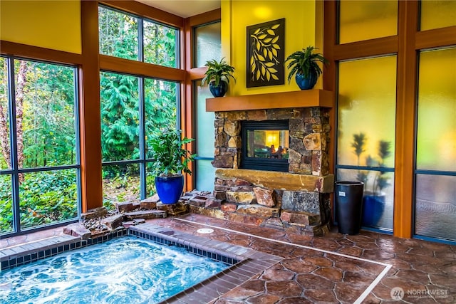 sunroom / solarium featuring healthy amount of natural light