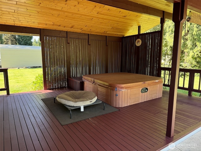 wooden terrace with a hot tub