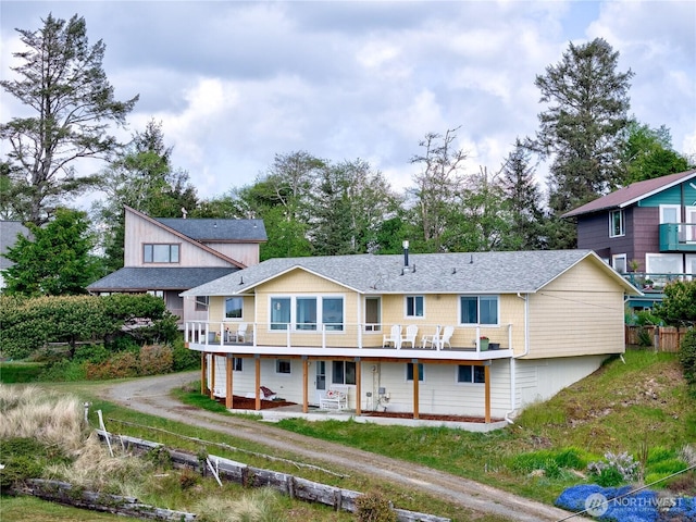 1005 346th Pl, Ocean Park, WA 98640 - rear view of house with a wooden deck