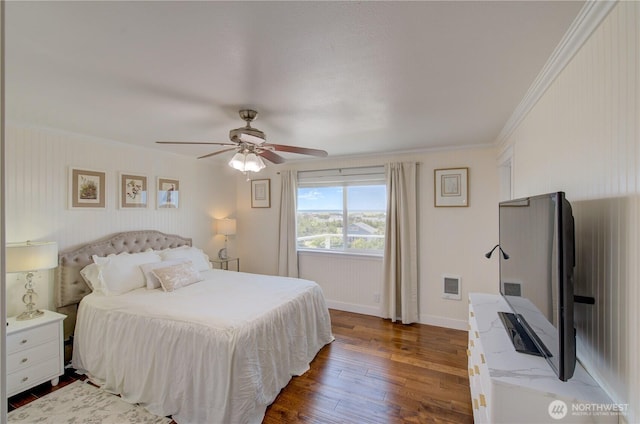 1005 346th Pl, Ocean Park, WA 98640 - bedroom featuring dark wood finished floors, ornamental molding, baseboards, and a ceiling fan