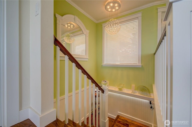 1005 346th Pl, Ocean Park, WA 98640 - stairway with a chandelier, ornamental molding, and wood finished floors
