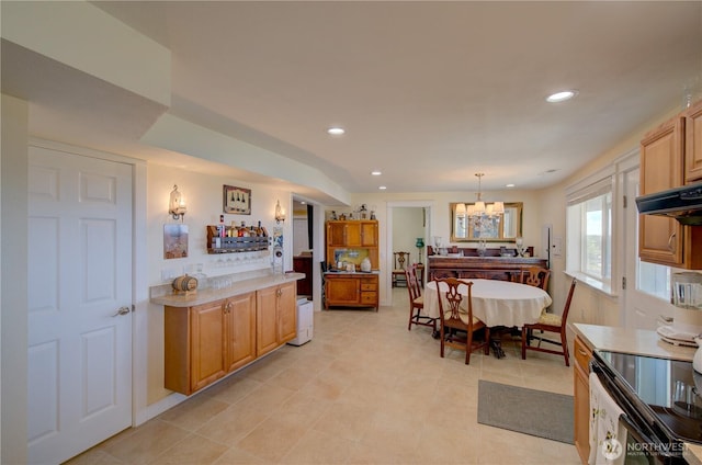 1005 346th Pl, Ocean Park, WA 98640 - kitchen featuring a chandelier, light countertops, recessed lighting, pendant lighting, and light tile patterned flooring