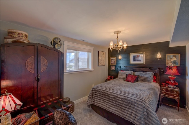 1005 346th Pl, Ocean Park, WA 98640 - carpeted bedroom with a chandelier, wooden walls, and baseboards