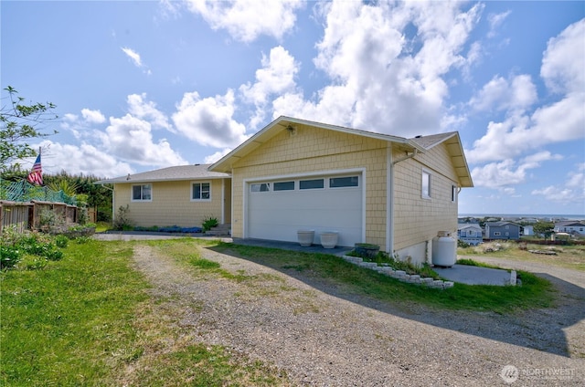 1005 346th Pl, Ocean Park, WA 98640 - ranch-style house with dirt driveway and an attached garage