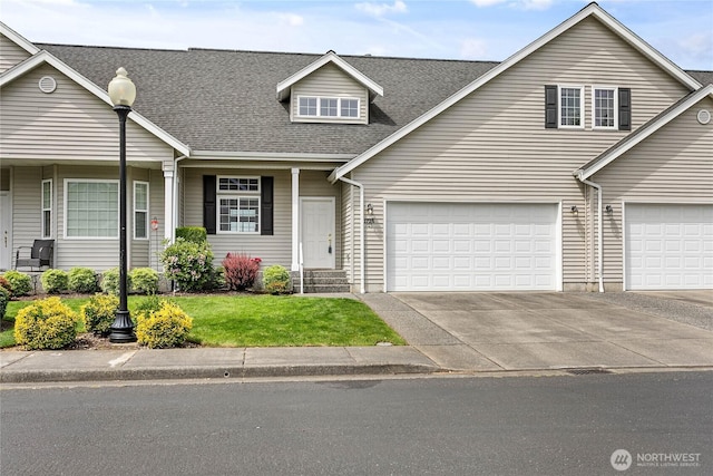 1725 Harrison Pl Unit 103, Lynden, WA 98264 - view of front of property featuring a shingled roof, concrete driveway, and a front yard