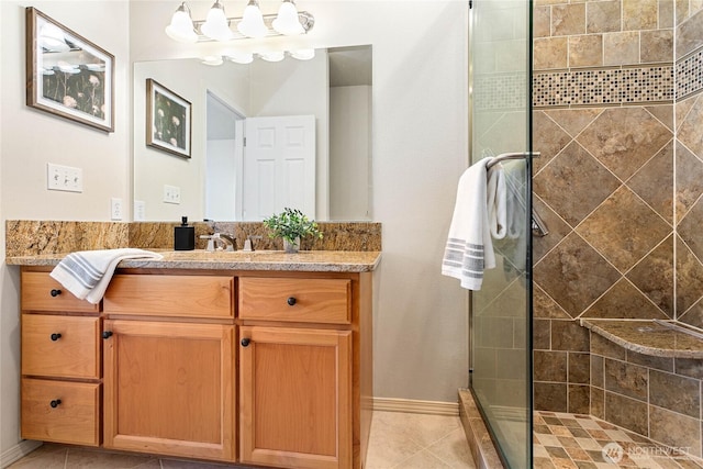 1725 Harrison Pl Unit 103, Lynden, WA 98264 - full bathroom featuring vanity, tiled shower, tile patterned floors, and baseboards
