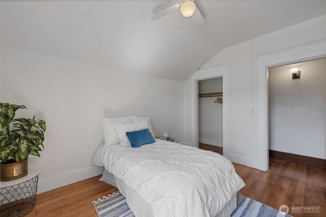3301 Mckinley Ave, Tacoma, WA 98404 - bedroom featuring a closet, wood finished floors, vaulted ceiling, a ceiling fan, and baseboards