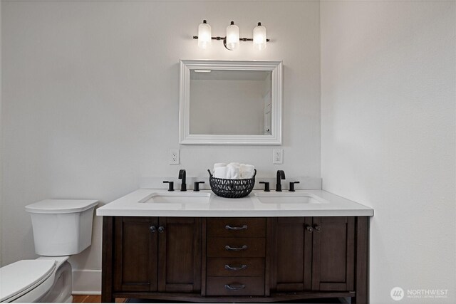 3301 Mckinley Ave, Tacoma, WA 98404 - bathroom with double vanity, toilet, and a sink