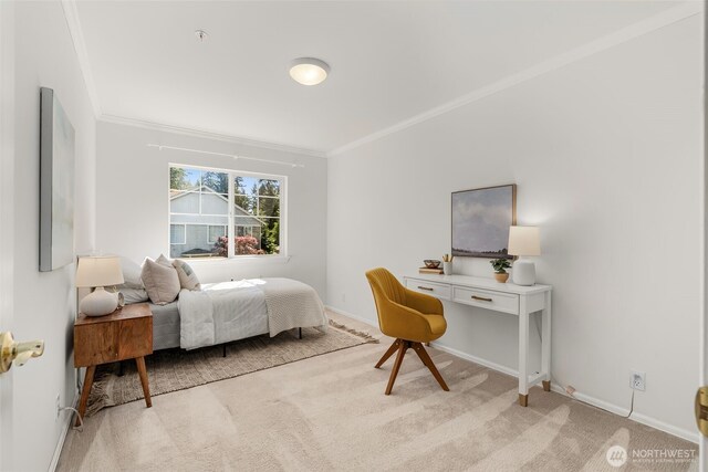 bedroom with ornamental molding, light colored carpet, and baseboards