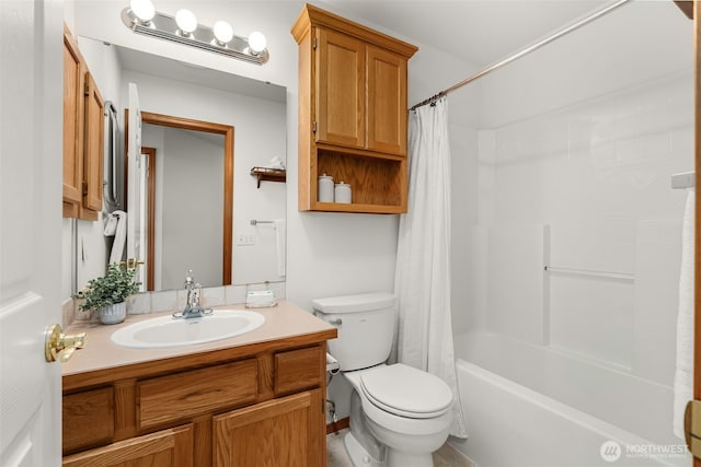 bathroom with toilet, vanity, and shower / bath combo with shower curtain