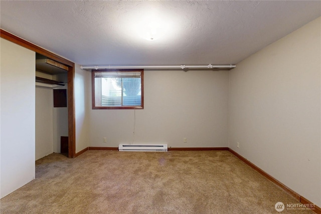 unfurnished bedroom with carpet flooring, a closet, a textured ceiling, and a baseboard radiator