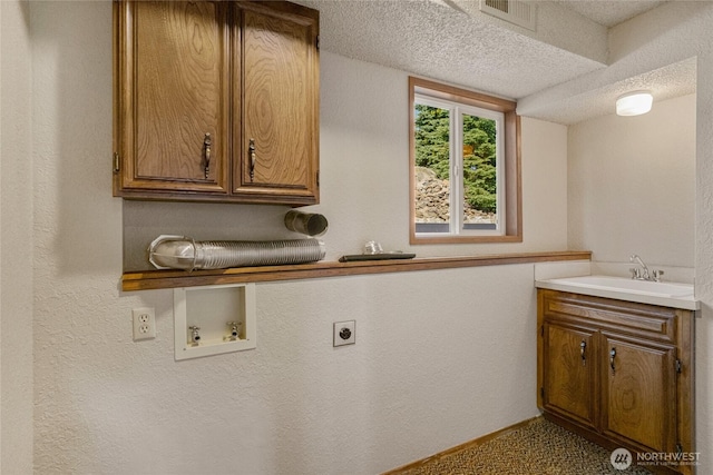clothes washing area with a sink, cabinet space, hookup for an electric dryer, visible vents, and hookup for a washing machine