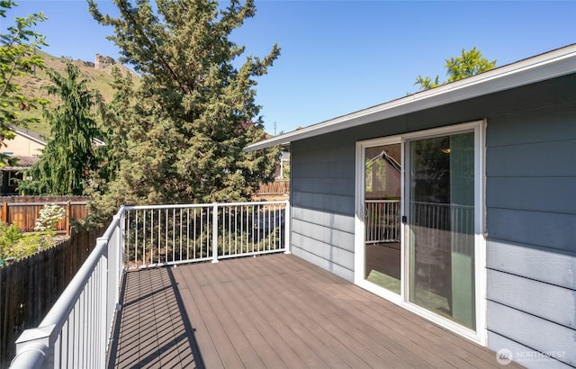 wooden deck featuring fence