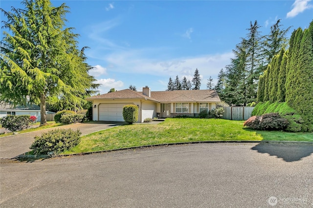 single story home featuring an attached garage, a chimney, and driveway