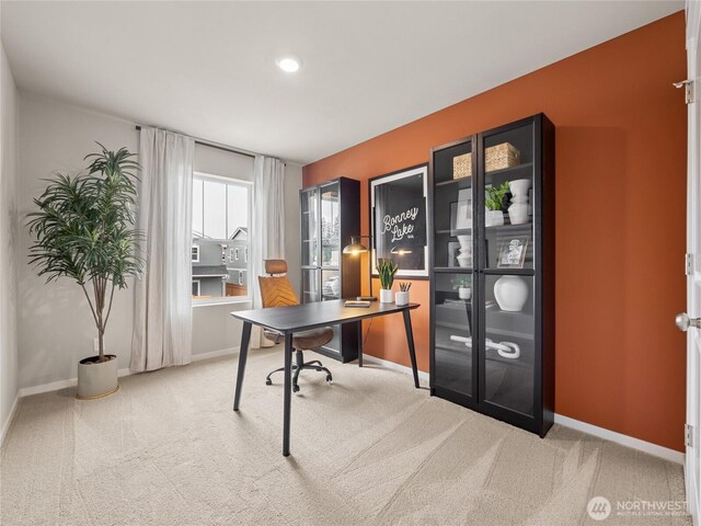 office featuring baseboards and carpet flooring