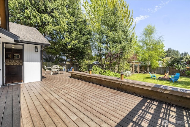 deck with a fire pit and outdoor dining area