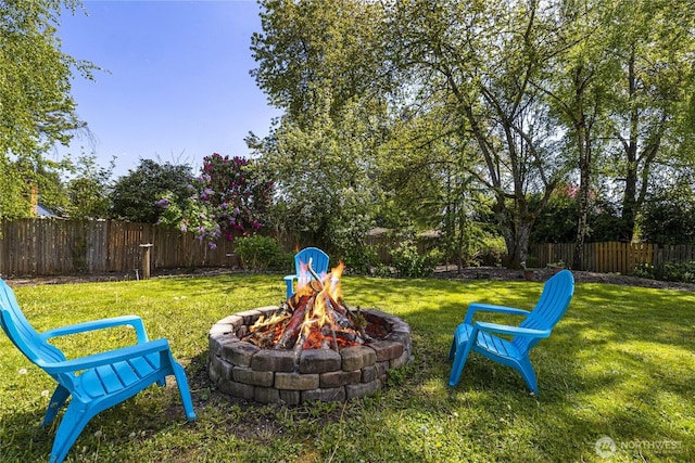 view of yard with an outdoor fire pit