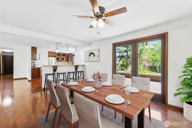 dining room with dark wood-style flooring, baseboards, and a ceiling fan