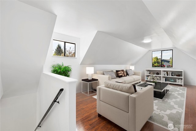 living area with hardwood / wood-style floors and lofted ceiling