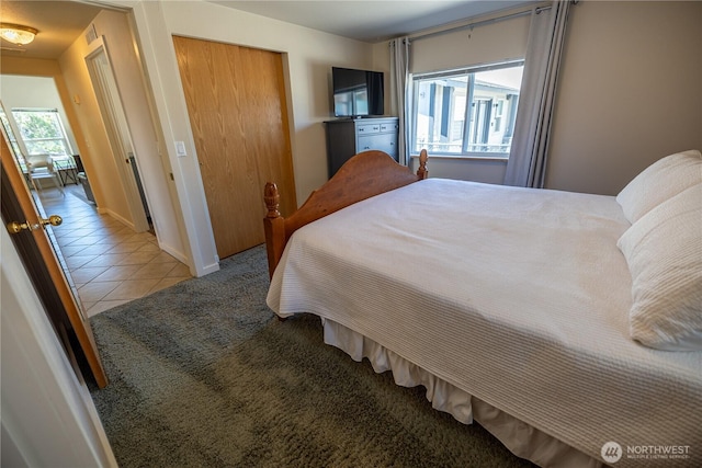 878 SW Hunter Ave, Quincy, WA 98848 - bedroom featuring a closet, tile patterned floors, and baseboards