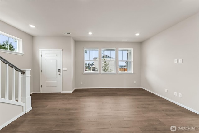 foyer featuring dark wood-style flooring, stairs, visible vents, and recessed lighting